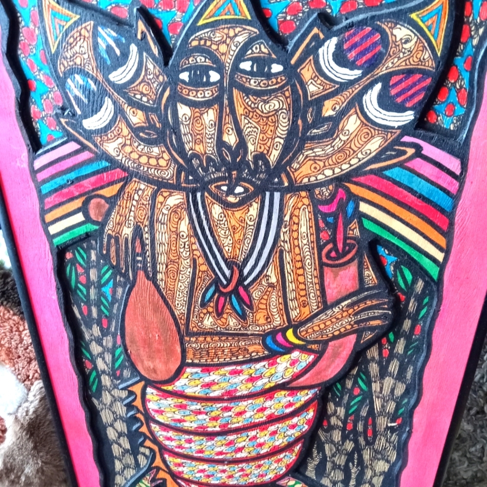 Hand carved and painted wall art by artist emmanuel Emvic,osogbo